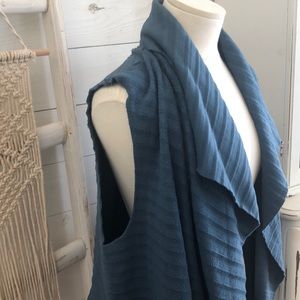 Cozy, teal layering vest.